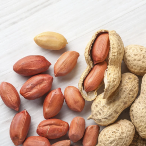 Peanuts, which grow underground, are encased in a thin, papery shell or pod.