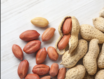 Peanuts, which grow underground, are encased in a thin, papery shell or pod.