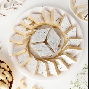 Kaju Katli, also known as Kaju Barfi, is a beloved traditional Indian sweet originating from the Deccan region